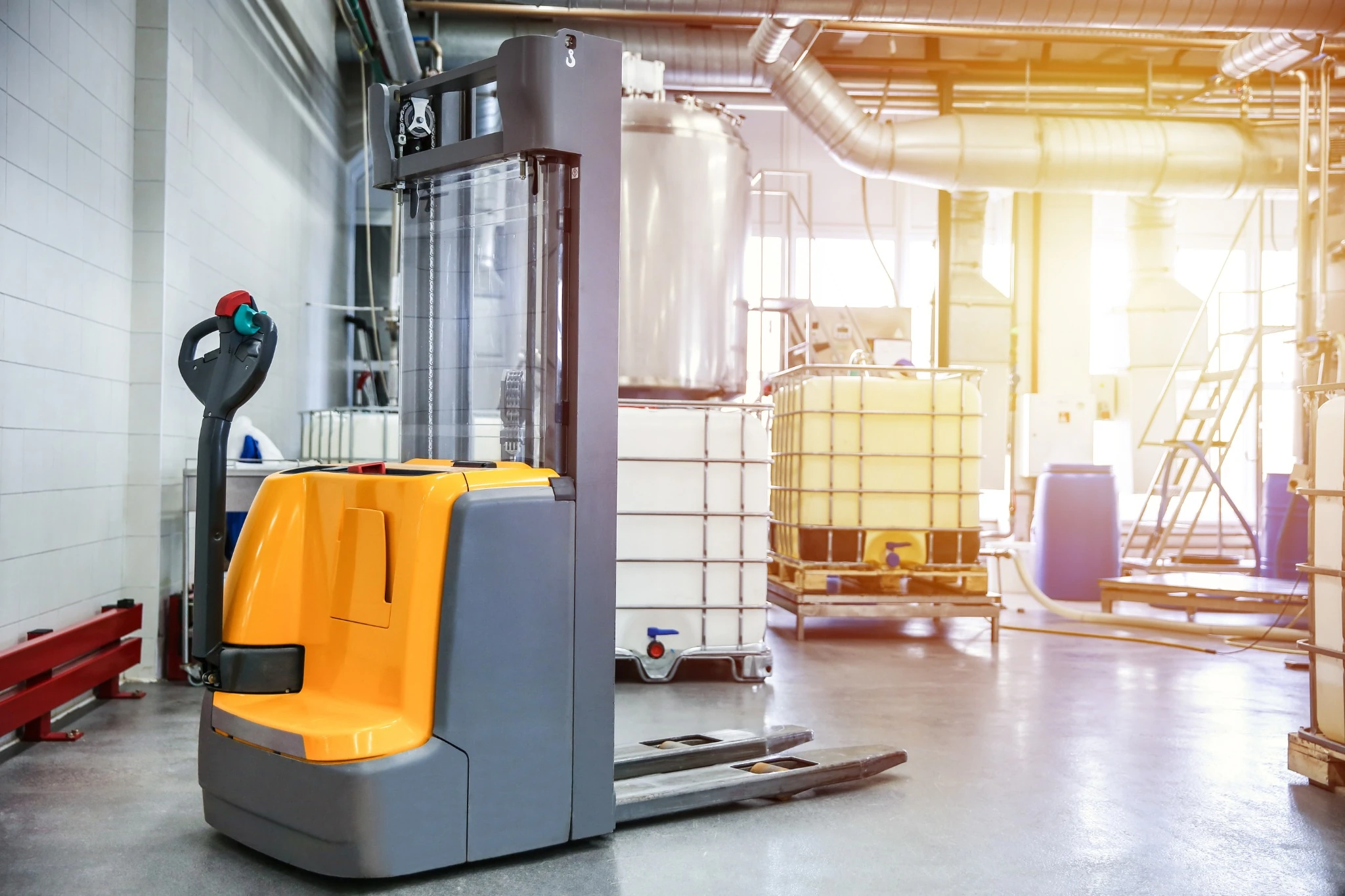 An electric walkie stacker positioned in a clean manufacturing facility in Ontario, Canada.